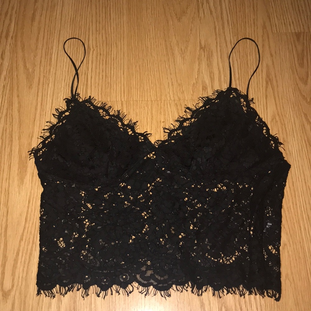 Not see through up top. Black lace tank crop top